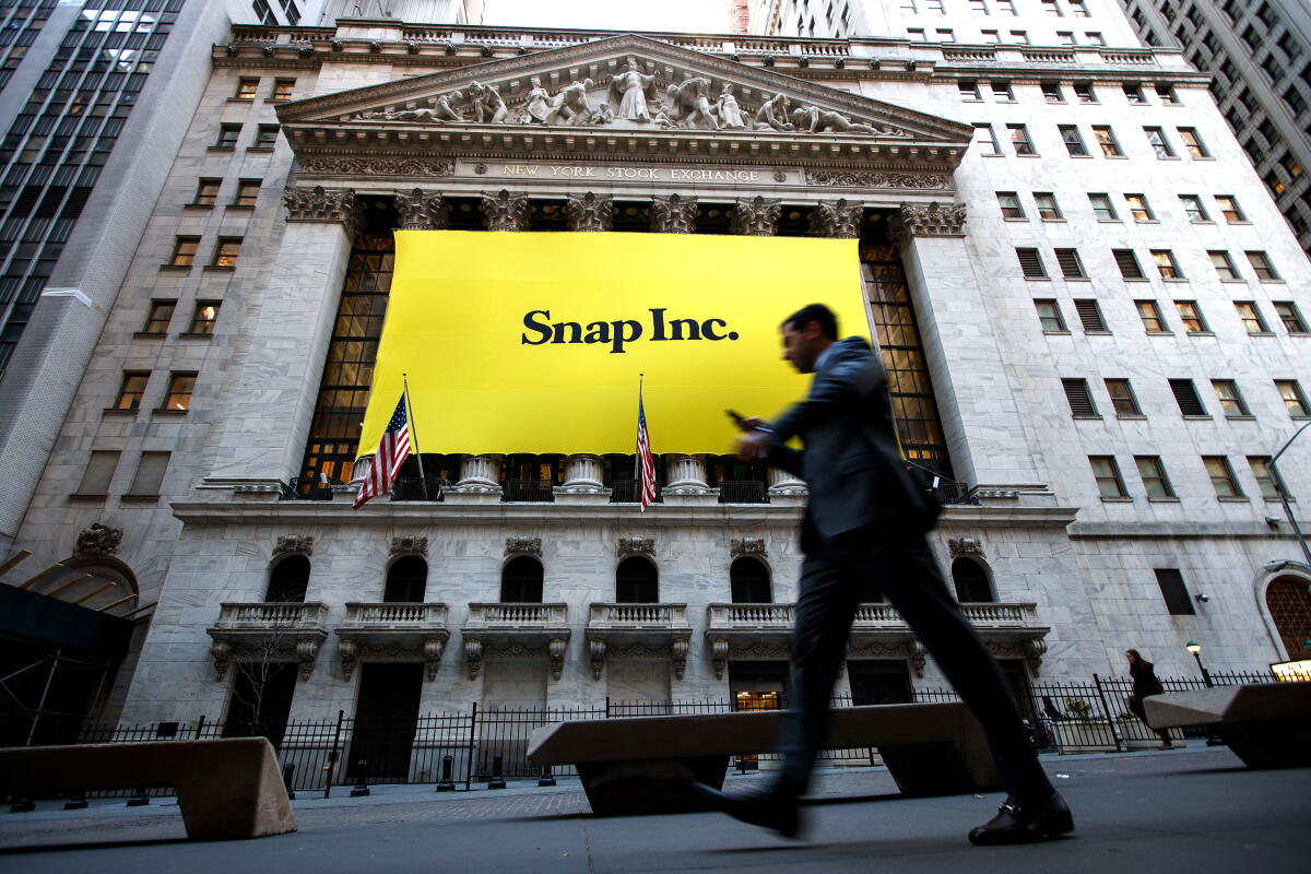 The New York Stock Exchange building with a large yellow 